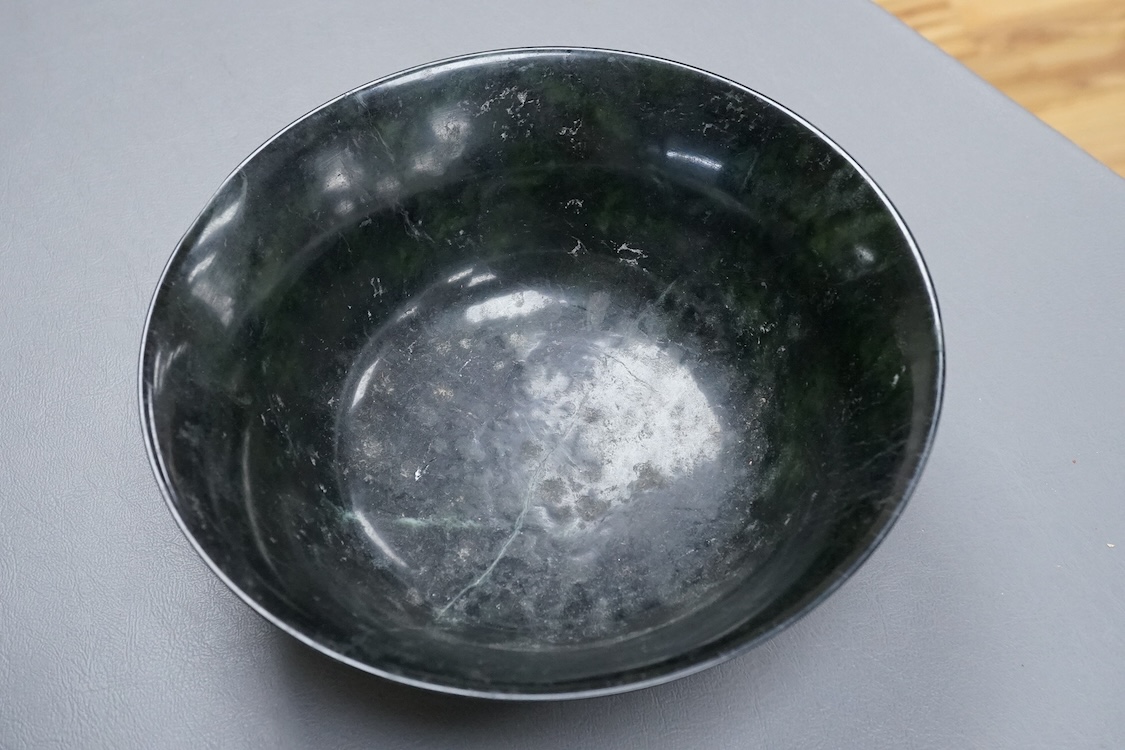 A Chinese spinach green jade bowl, 21cm diameter